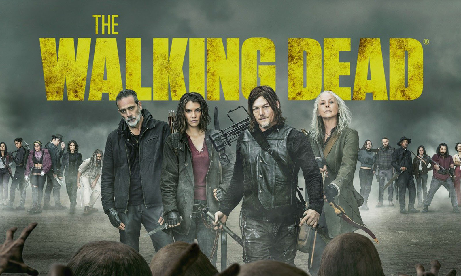 Personagens principais no pôster oficial da terceira parte da 11ª temporada com a logo de The Walking Dead ao fundo.