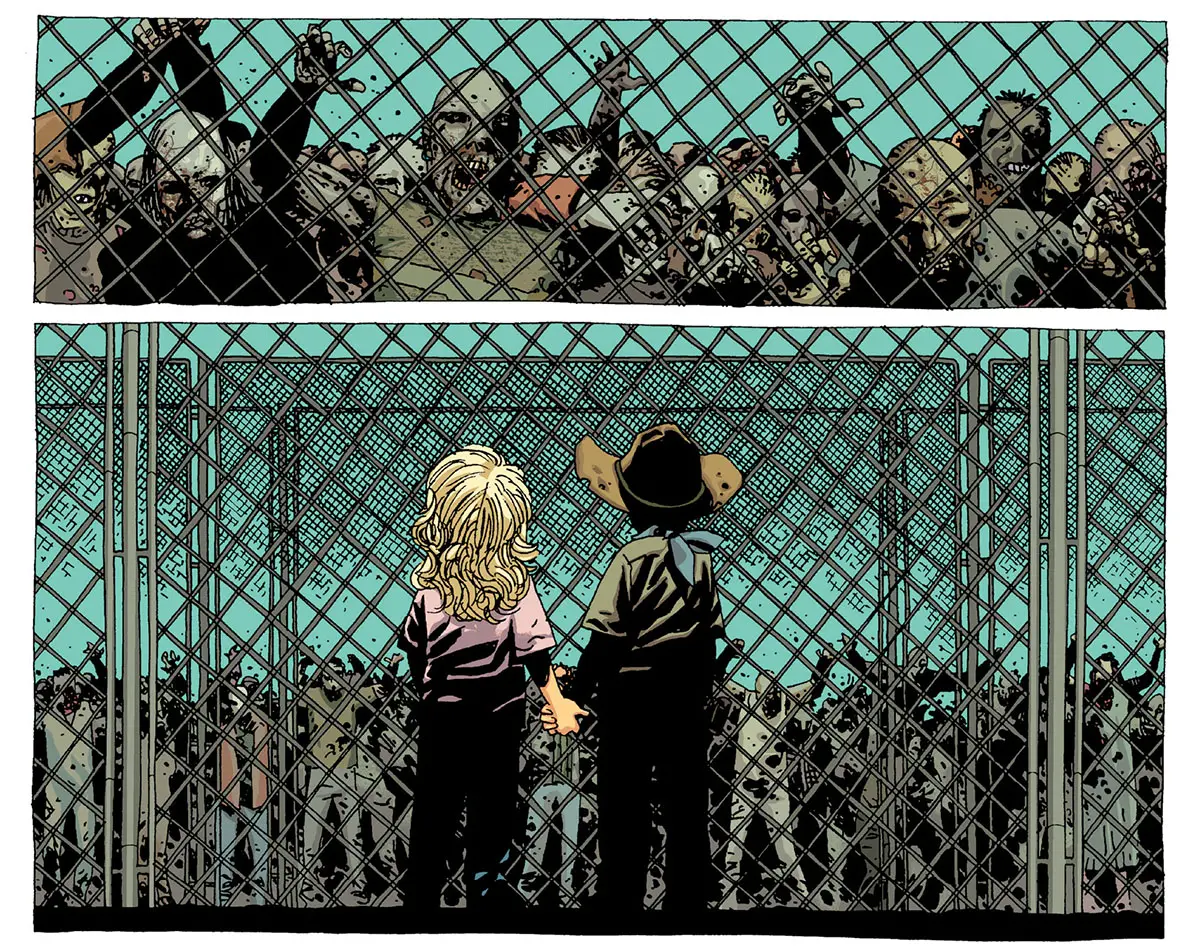 Carl e Sophia de mãos dadas observando os zumbis na grade da prisão na edição 21 da The Walking Dead Deluxe.