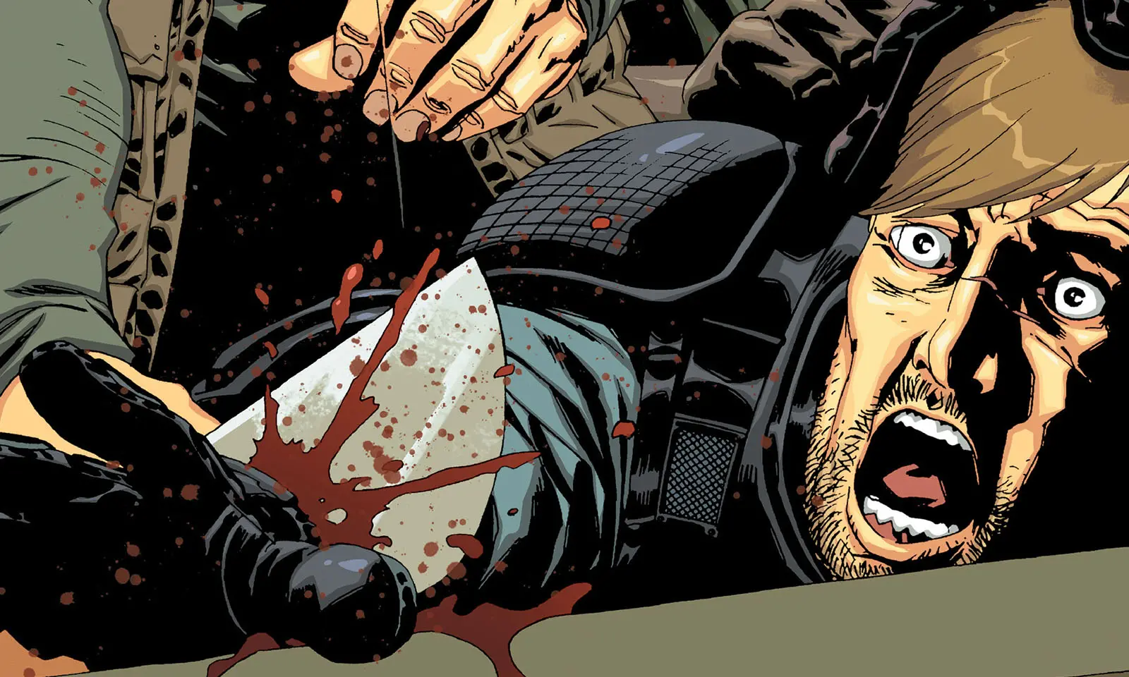 Rick tendo sua mão cortada pelo Governador na Edição 28 dos quadrinhos de The Walking Dead.
