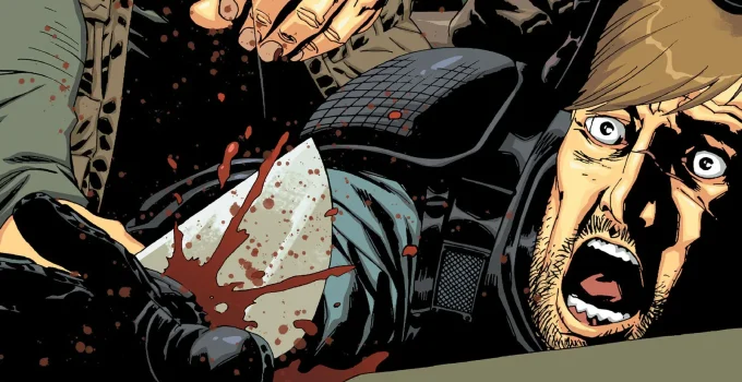 Rick tendo sua mão cortada pelo Governador na Edição 28 dos quadrinhos de The Walking Dead.